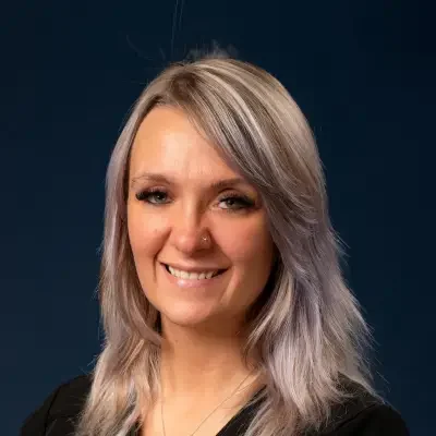 Professional headshot of Lorraine
